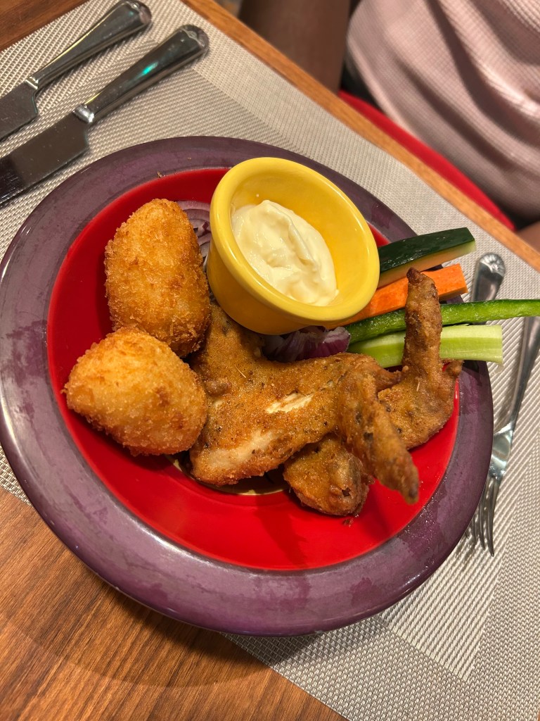 Island-spiced chicken wings with macaroni and cheese bites from The Beach House restaurant